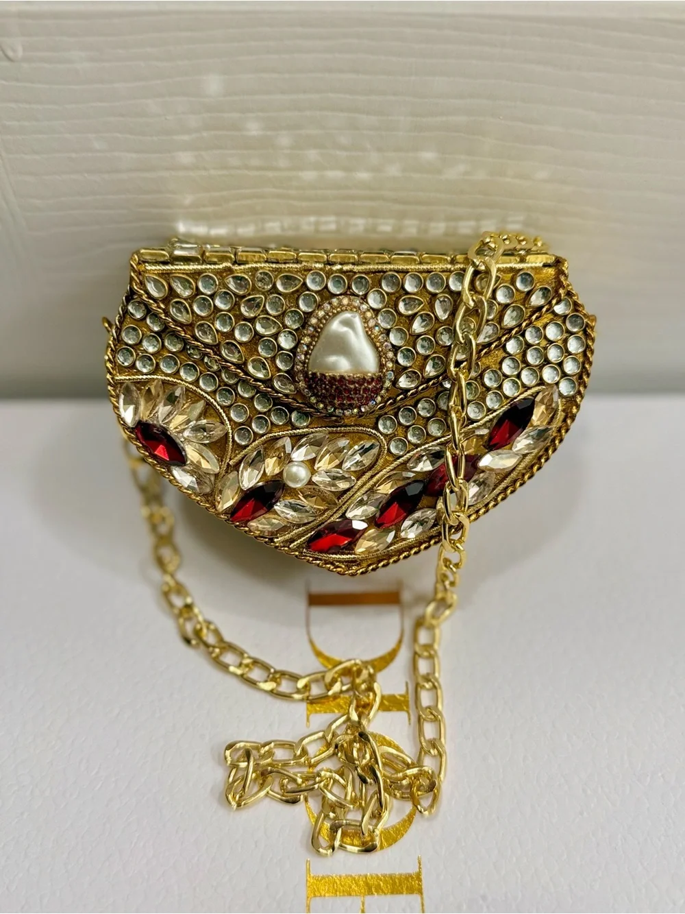 Embellished Gold Mini Crossbody Bag with Red Gem Accents
